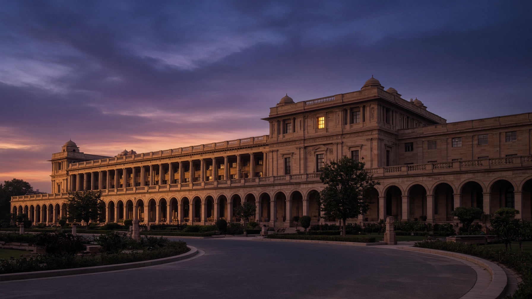 Sandstone government building at dusk